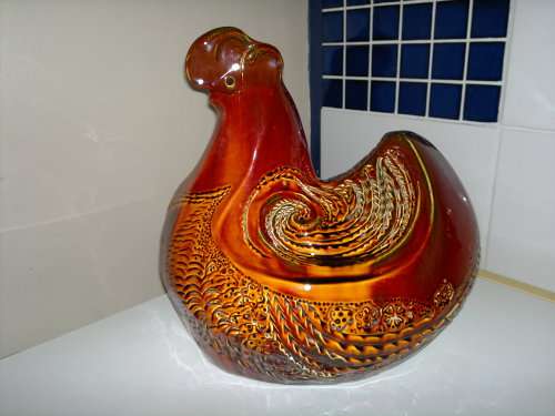 A Door stop or a display item a Large and Heavy pottery glazed Brown Hen.