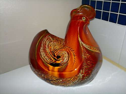A Door stop or a display item a Large and Heavy pottery glazed Brown Hen.