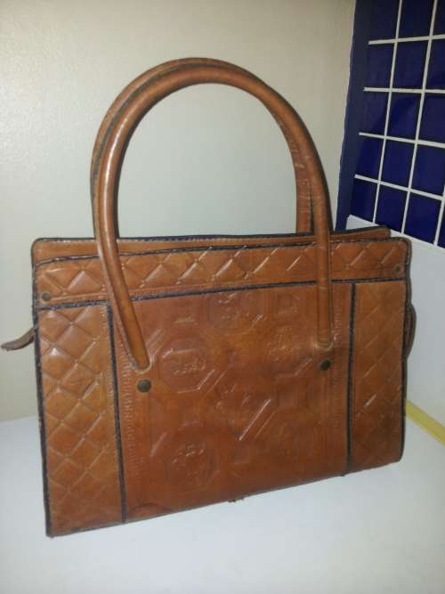 A must for the Lady a Genuine brown Leather Hand Bag with two straps and zip working.