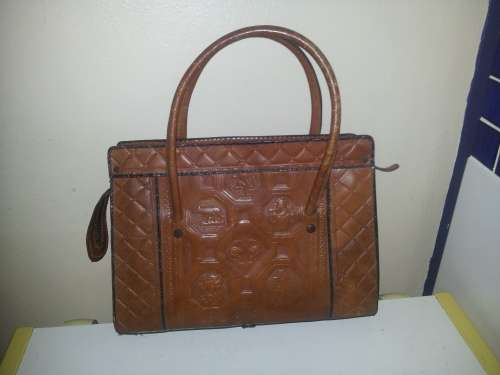 A must for the Lady a Genuine brown Leather Hand Bag with two straps and zip working.