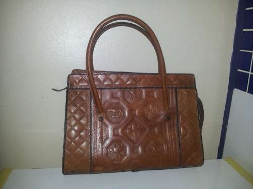 A must for the Lady a Genuine brown Leather Hand Bag with two straps and zip working.