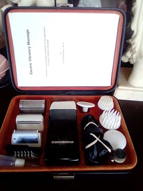 A vintage ` Combina` dual purpose Razor/Massager in original carry case with instructions.