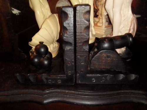 A Man Cave special.Cannon on the one side and the 4 powder Ball`s on the other Bookends.