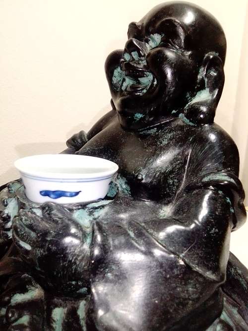 Large Green Buda with (We Think) ceramic?  bowl sitting on a money bag. In good condition.