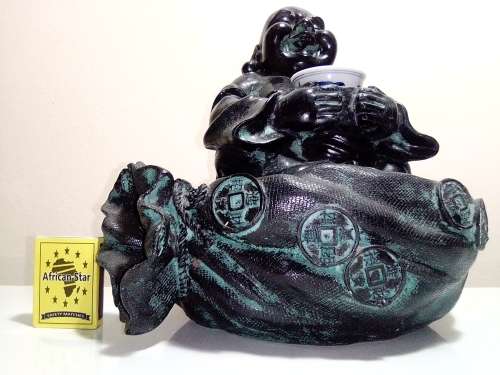 Large Green Buda with (We Think) ceramic?  bowl sitting on a money bag. In good condition.