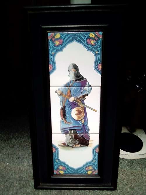 A rare `Man of War` 3 tile plaque from Algeria mounted in a Old solid wooden frame.