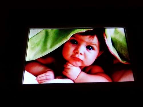 A `Coby` 7 ` Digital photo frame plug in and play with Instructions and Charger in box.