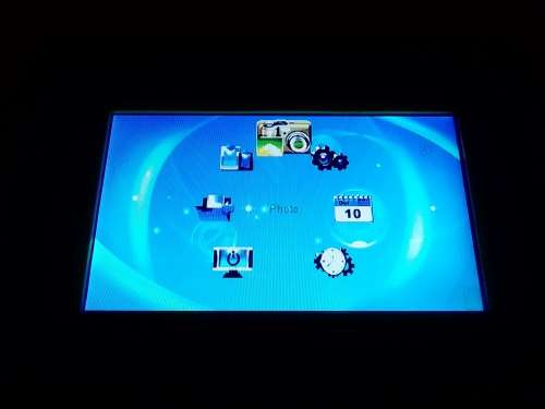 A `Coby` 7 ` Digital photo frame plug in and play with Instructions and Charger in box.
