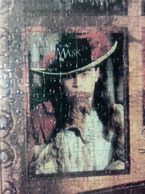 `The Man in the Iron Mask` staring Leonardo De Caprio Puzzel under glass in a solid wood frame.