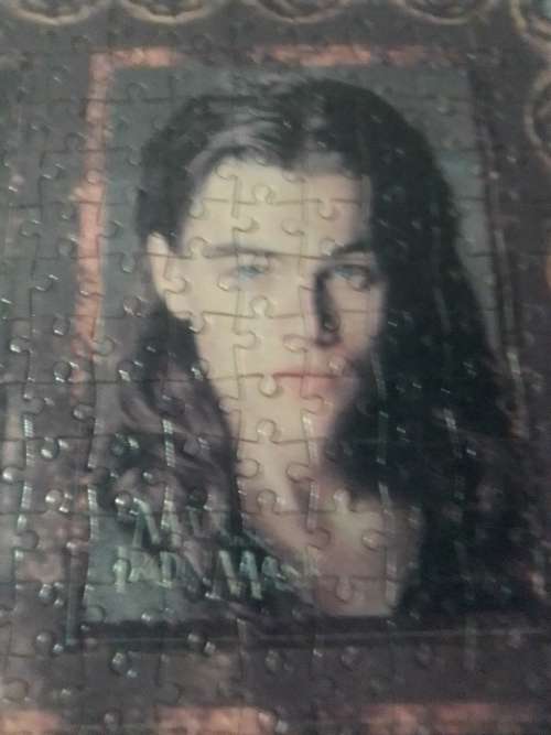 `The Man in the Iron Mask` staring Leonardo De Caprio Puzzel under glass in a solid wood frame.