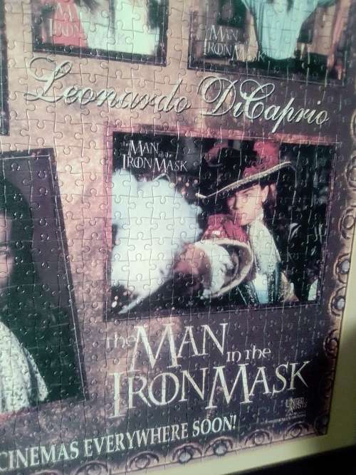 `The Man in the Iron Mask` staring Leonardo De Caprio Puzzel under glass in a solid wood frame.