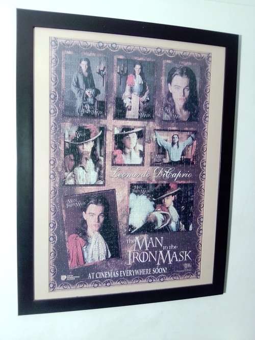 `The Man in the Iron Mask` staring Leonardo De Caprio Puzzel under glass in a solid wood frame.