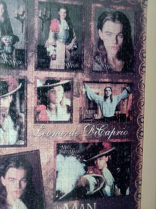`The Man in the Iron Mask` staring Leonardo De Caprio Puzzel under glass in a solid wood frame.