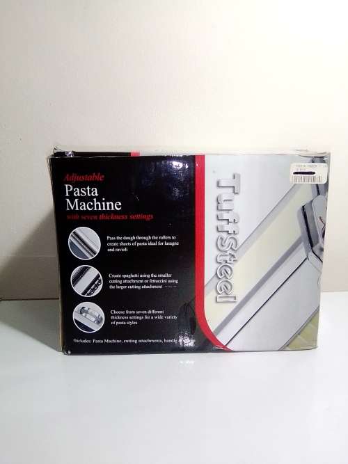 A boxed TUFFSTEEL Adjustable Pasta Machine complete with bracket and drive handle.