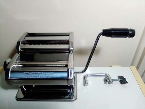 A boxed TUFFSTEEL Adjustable Pasta Machine complete with bracket and drive handle.