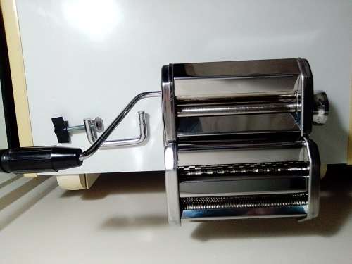 A boxed TUFFSTEEL Adjustable Pasta Machine complete with bracket and drive handle.