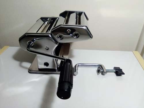 A boxed TUFFSTEEL Adjustable Pasta Machine complete with bracket and drive handle.