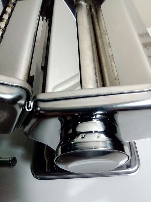 A boxed TUFFSTEEL Adjustable Pasta Machine complete with bracket and drive handle.