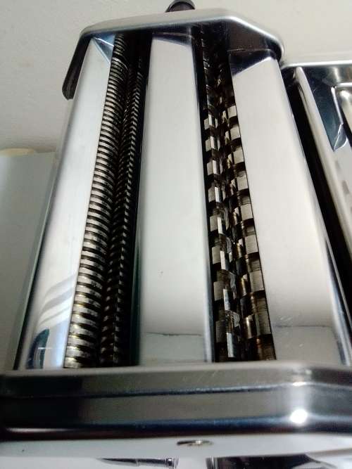 A boxed TUFFSTEEL Adjustable Pasta Machine complete with bracket and drive handle.