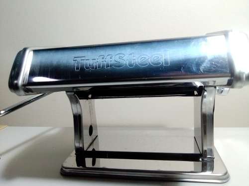 A boxed TUFFSTEEL Adjustable Pasta Machine complete with bracket and drive handle.