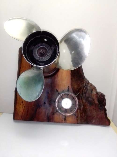 In good order a R3k Mercury Marine boat Propeller and Thermometer mounted on a Oak Wooden base