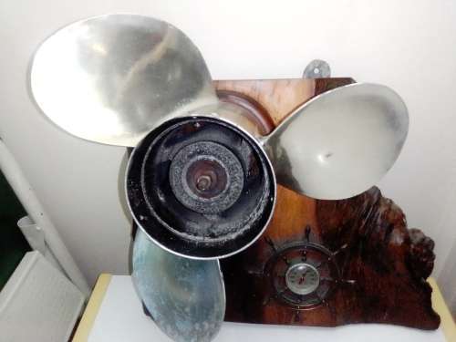In good order a R3k Mercury Marine boat Propeller and Thermometer mounted on a Oak Wooden base