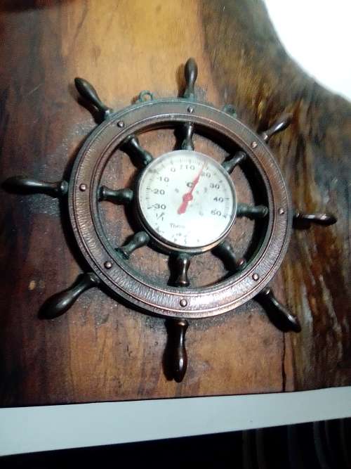 In good order a R3k Mercury Marine boat Propeller and Thermometer mounted on a Oak Wooden base