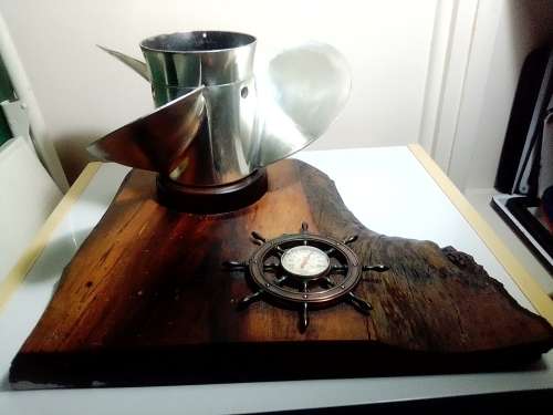 In good order a R3k Mercury Marine boat Propeller and Thermometer mounted on a Oak Wooden base