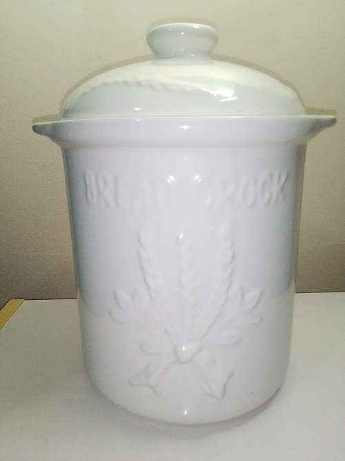 A large ceramic `Bread Crock` bin.