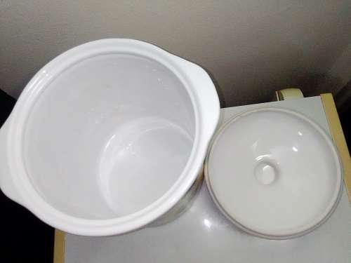 A large ceramic `Bread Crock` bin.