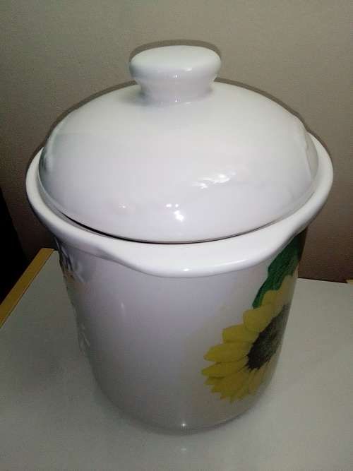 A large ceramic `Bread Crock` bin.