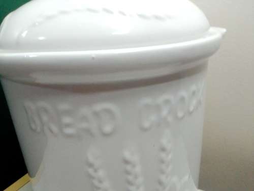 A large ceramic `Bread Crock` bin.