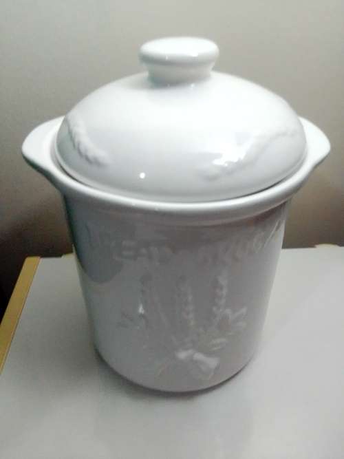 A large ceramic `Bread Crock` bin.