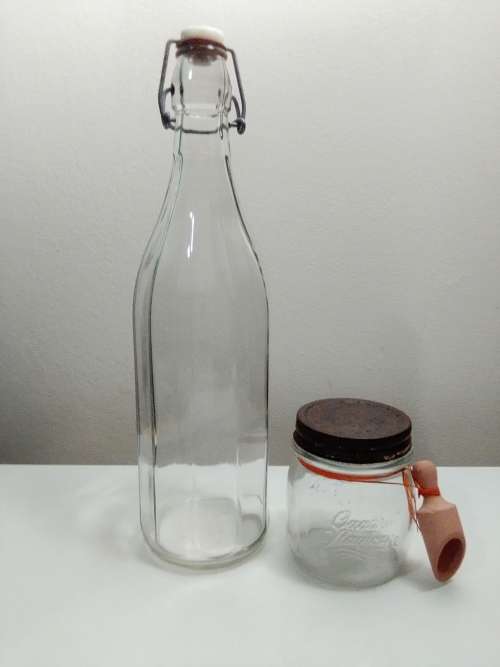 2 Unusual glass storage bottle`s, a Bormioli Rocco with spoon and a Swing Top Glass Bottle