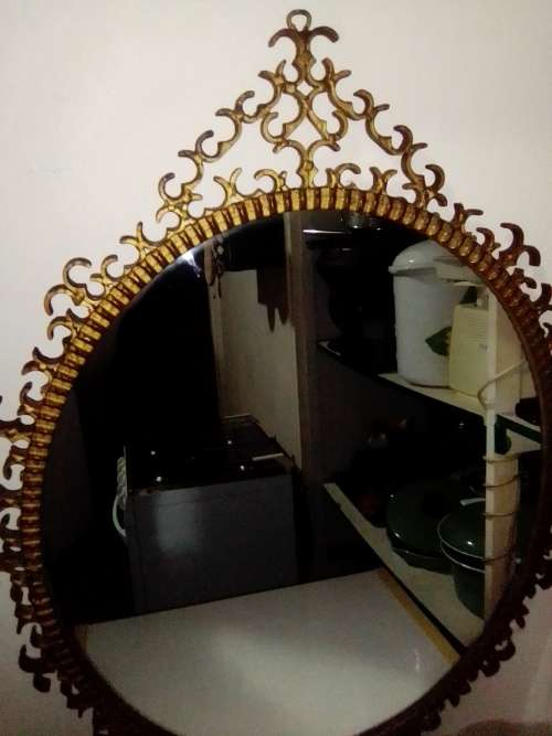 Awesome A 1900`s Wrought iron wall hanging mirror in fair to good used condition.