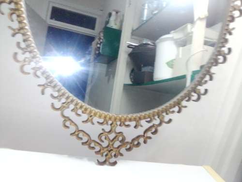 Awesome A 1900`s Wrought iron wall hanging mirror in fair to good used condition.