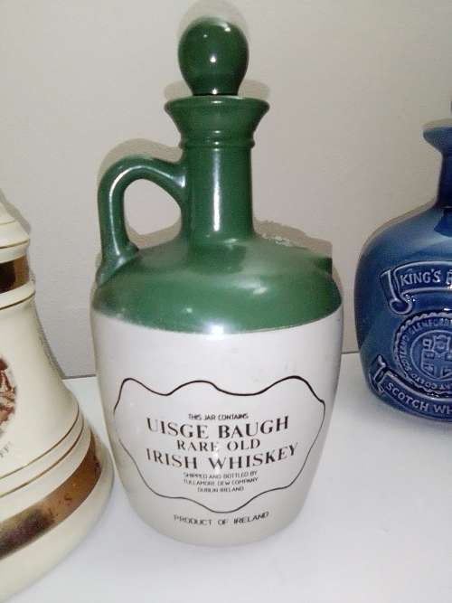 3 items. Bells Scotch 8year (Wade) and Tullamore Dew and King`s Ransom Irish Whiskey empty bottle`s