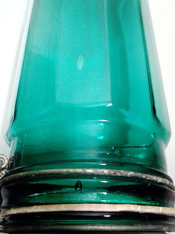 Hand Blown Green Preservation Bottles with glass lids.