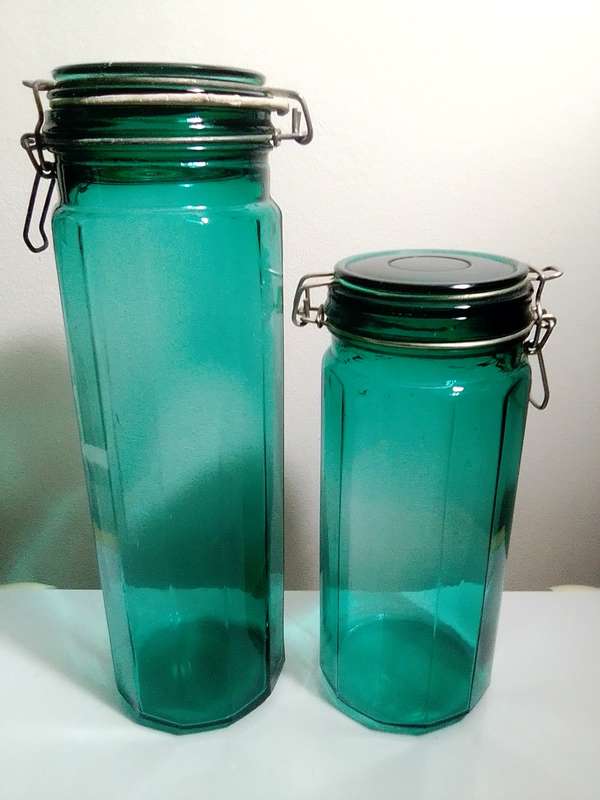 Hand Blown Green Preservation Bottles with glass lids.