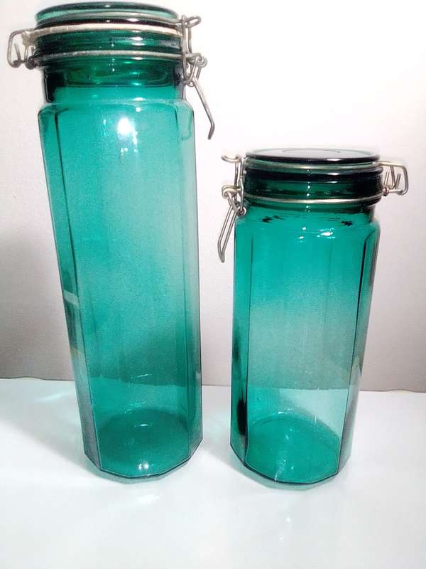 Hand Blown Green Preservation Bottles with glass lids.