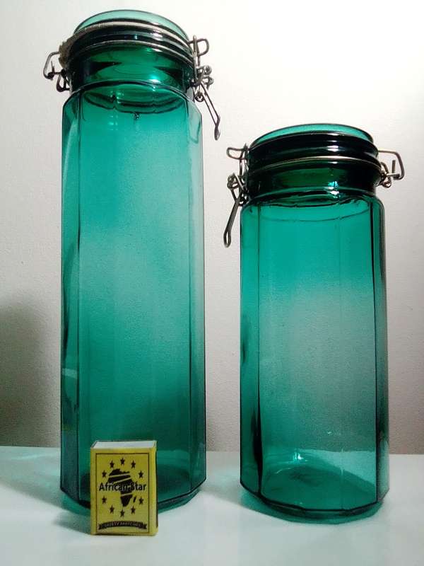 Hand Blown Green Preservation Bottles with glass lids.
