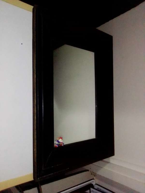 A 1930`s vintage a real Old solid Wooden Framed mirror in good condition for its AGE.