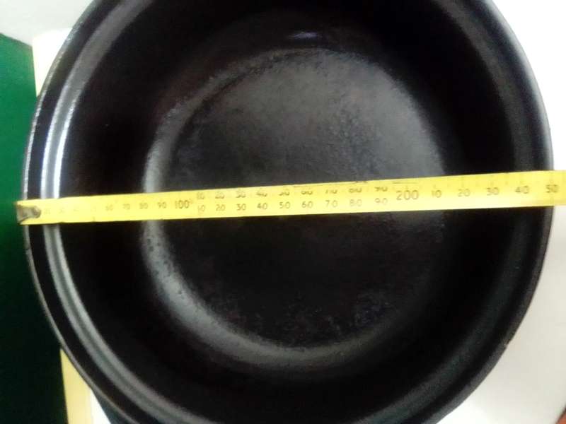 A well-used and in pristine orde, vintage Cookwell orange enameled lidded cast iron cooking pot No8.