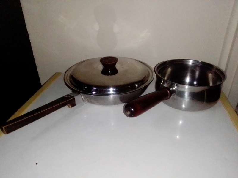2 cooking pots, A `ALOE` copper based lidded long handled 26cm 18/8 stainless skillet + smaller pot.