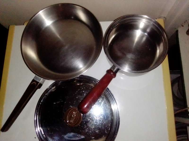 2 cooking pots, A `ALOE` copper based lidded long handled 26cm 18/8 stainless skillet + smaller pot.