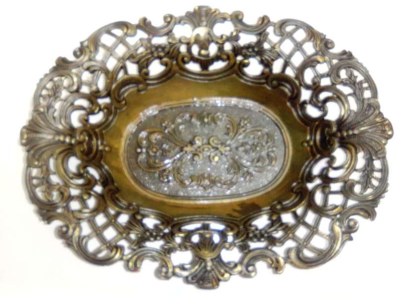 A Vintage Bronze trinket dish with filigree and a stamp ` Mod dep made in Italy `