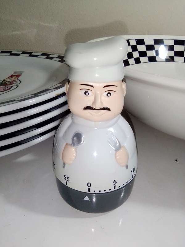 A vintage Trisa Stoneware Fat Chef bowl plus 5 matching large dinner plate`s plus a Chef timer.