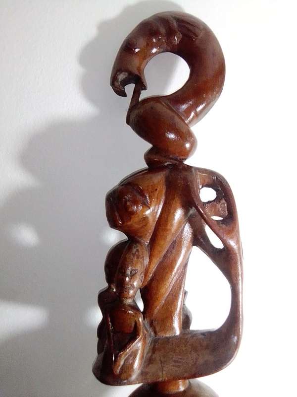 The Nyaminyami is described as having the body of a snake the head of a fish. Ethnic Walking Stick.
