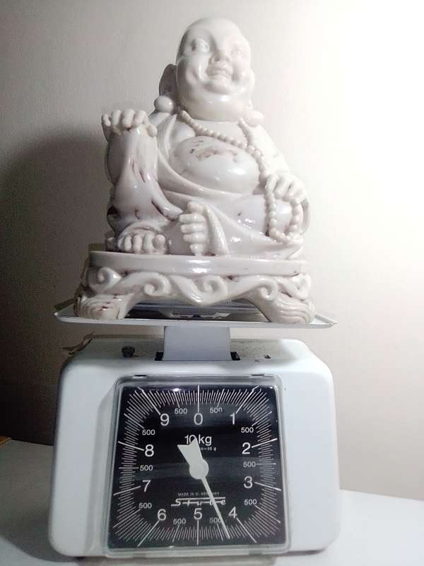Antique Large and Heavy 4.5Kg`s laughing Buddha cast in crushed marble stone and Resin mixture.