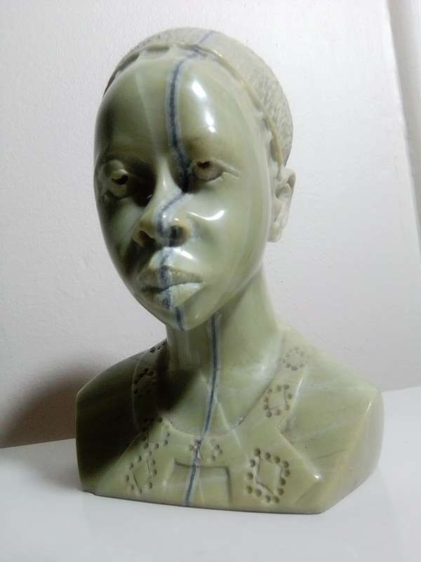 A exquisitely hand carved Jade green African bust by artist Willis Nxumalo from KZN in RSA.   1.1Kgs